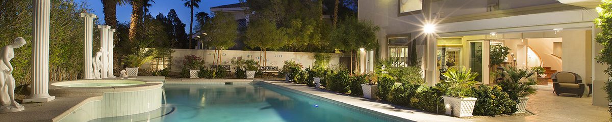 Real photograph of a Las Vegas Valley home exterior with mature landscaping
